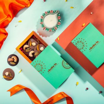 Dark and milk chocolate mendiants with nuts and fruits
